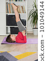Child exercising at home. Physical and mental health trend 101049144
