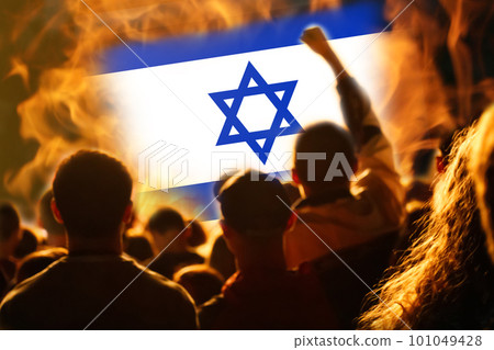 Protests Israel Tel Aviv. Israel flag. Protest in Israel 2023. Rise hand. Defense minister. Fire. Out of focus 101049428