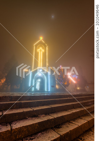 Ancient stone church of Sapa with mist night sky. Ancient stone church of Sapa with mist night sky. 101049646