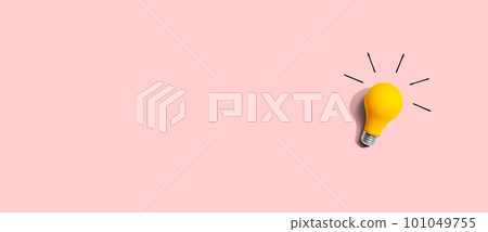 Yellow light bulb - flat lay 101049755