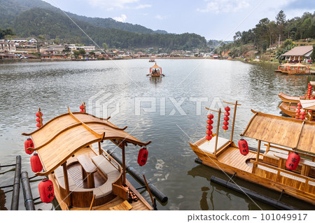 Ban Rak Thai, a beautiful village within Mae Hong Son province, Thailand, with scenic lake. Traditional boats are available for hire. Chinese words translated as Guest in English language. 101049917