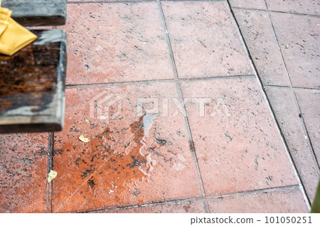 Spilled drink on a wooden picnic bench. Spilled drink on a wooden picnic bench. 101050251
