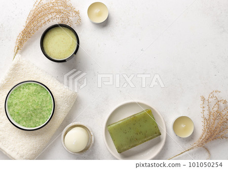 beauty products flatlay and bath towels on a white stone background beauty products flatlay and bath towels on a white stone background 101050254