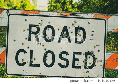 Buckshot road closed sign in front of a washed out bridge Buckshot road closed sign in front of a washed out bridge 101050326