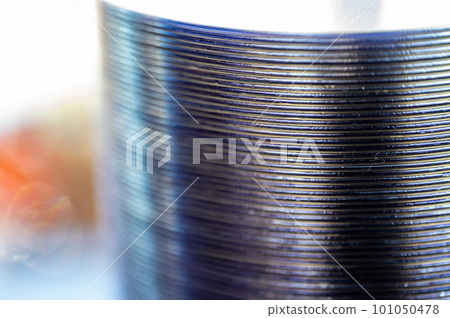 Selective focus on a sleeve of compact discs CD's used for storing electronic media. 101050478