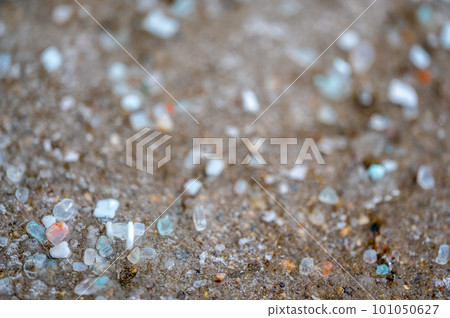 macro ground level closeup view of rock salt ice-melt on concrete with a frozen layer. macro ground level closeup view of rock salt ice-melt on concrete with a frozen layer. 101050627