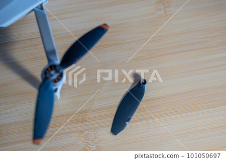 Damaged plastic drone rotor propeller blade caused by flying into an object and crashing. Damaged plastic drone rotor propeller blade caused by flying into an object and crashing. 101050697