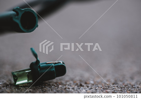 Focus on replacement bulb for a string of Christmas lights to repair a dud.  101050811