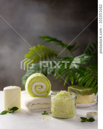 spa background with sea salt, solid soap, candles and bath towels 101051082