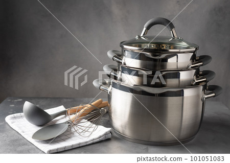 set of various cookware and utensils on dark background 101051083