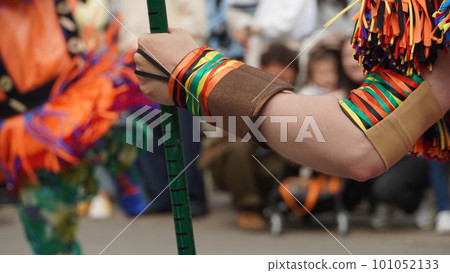 back view of colorful ethnic clothes with a spear back view of colorful ethnic clothes with a spear 101052133