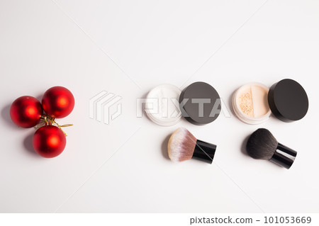 Mineral makeup powder twist seal sifter isolated on white background with brush copy space. Many beige foundation powder. Skin tone face cosmetic product sample Mineral makeup powder twist seal sifter isolated on white background with brush copy space. Many beige foundation powder. Skin tone face cosmetic product sample 101053669