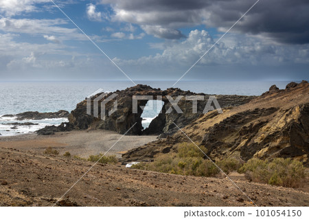Pena Horadada beach with giant rocks, Fuerteventura Pena Horadada beach with giant rocks, Fuerteventura 101054150