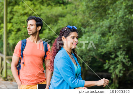 Senda del oso, Teverga Asturias. mixed race travelers couple hiking ecotourism conservation path Senda del oso, Teverga Asturias. mixed race travelers couple hiking ecotourism conservation path 101055365