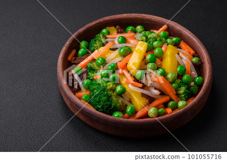 Delicious steamed vegetables broccoli, mushrooms, peas, carrots and onions 101055716