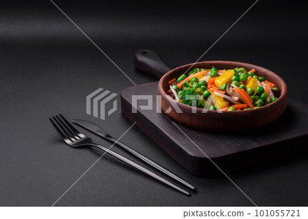 Delicious steamed vegetables broccoli, mushrooms, peas, carrots and onions 101055721
