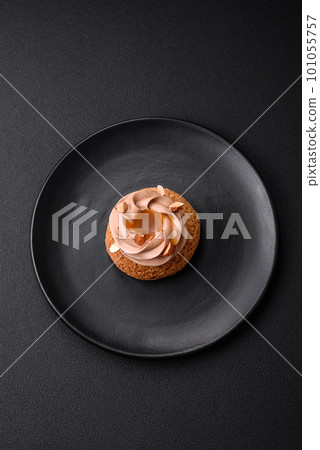 Delicious sweet shu cake with cream and nuts 101055757