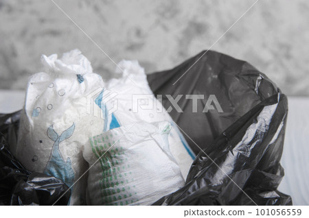 Garbage bag with waste, plastic and diapers close-up. Environment, ecology, zero waste. 101056559