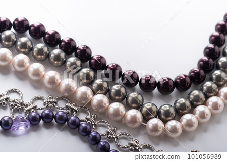 different colors pearls beads pesented together against white background. fashion and jewelry concept different colors pearls beads pesented together against white background. fashion and jewelry concept 101056989