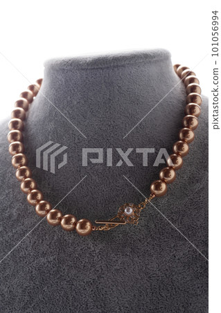 author handmade golden pearls necklace presented on maneken. fashion and jewelry concept author handmade golden pearls necklace presented on maneken. fashion and jewelry concept 101056994