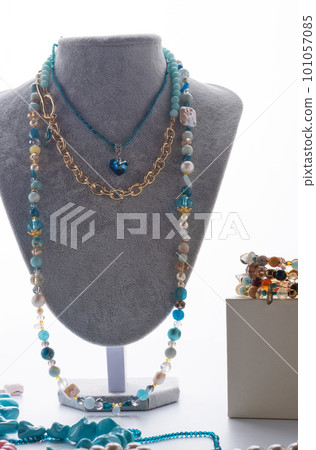 author set with different blue colors necklaces presented on maneken against white background. jewelry and hobby concept. trends2023 author set with different blue colors necklaces presented on maneken against white background. jewelry and hobby concept. trends2023 101057085