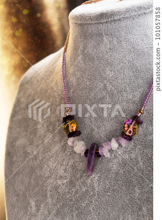 stylish  handmade author choker with amethyst. hobby and fashion concept 101057858