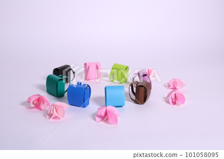Colorful school bags and cherry blossoms made from colored paper Colorful school bags and cherry blossoms made from colored paper 101058095