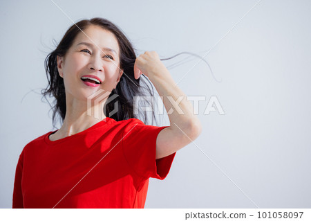 Senior woman hair care image Senior woman hair care image 101058097