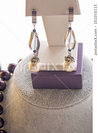 author beautiful  pearls  jewelry  demonstrated around white backround. fashion and jewelry concept 101058115