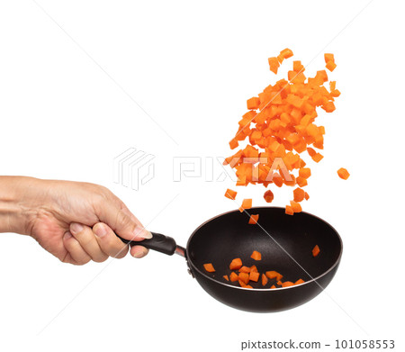 Carrot fresh fly float in Air turn to Cube dice shape. Beta Carotene orange color in Carrot is good health. Many Dice cube carrot flying throw up in Air by cooking pan. White background isolated 101058553
