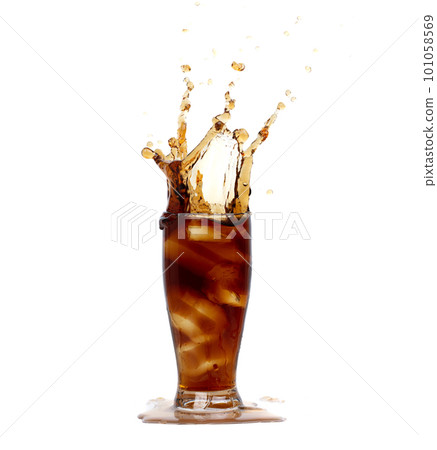 Ice Coffee Drink and Ice Tea tall glass splash up in Air. Cold brew ice coffee tea in cool glass drop splash and spill out of glass. White background isolated, high speed shutter freeze motion 101058569