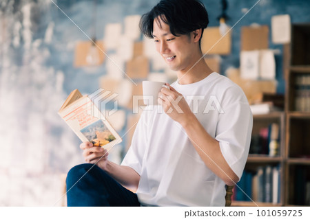 man enjoying coffee at home man enjoying coffee at home 101059725