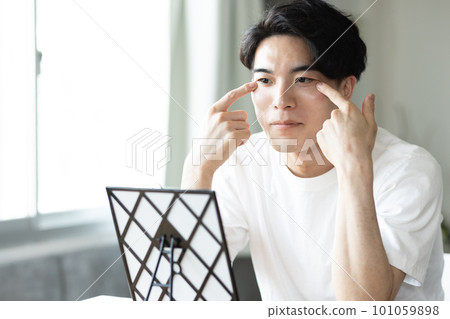 Young men doing skin care 101059898