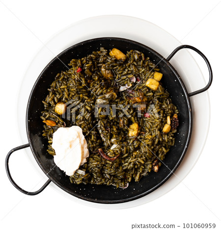 Traditional Catalan black paella with cuttlefish ink served with aioli Traditional Catalan black paella with cuttlefish ink served with aioli 101060959