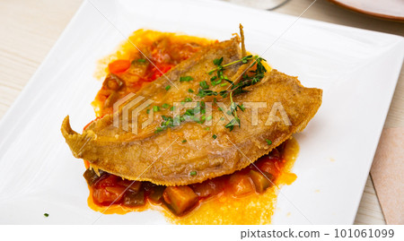 Fried sole fish with herbal oil and stewed vegetables Fried sole fish with herbal oil and stewed vegetables 101061099