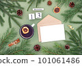 December 13. Calendar date, white blank with craft envelope, cup of tea and natural decor on green background. Hello winter. Template for your design, greeting card 101061486