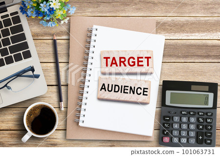 TARGET AUDIENCE, Text on notebook in office desk workplace background. TARGET AUDIENCE, Text on notebook in office desk workplace background. 101063731