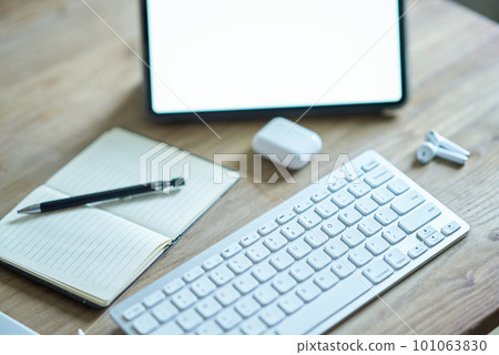 A set of business tools such as a tablet PC placed on a casual table A set of business tools such as a tablet PC placed on a casual table 101063830