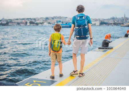 Boy and father tourists enjoying Galataport area view, cruise port of Istanbul newly opening in 2021, located in the shores of the Galata, Karakoy in Istanbul. Traveling with kids concept 101064040