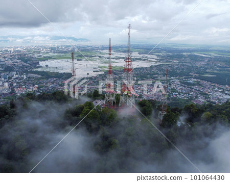 Aerial view telecommunication tower at hill top 101064430