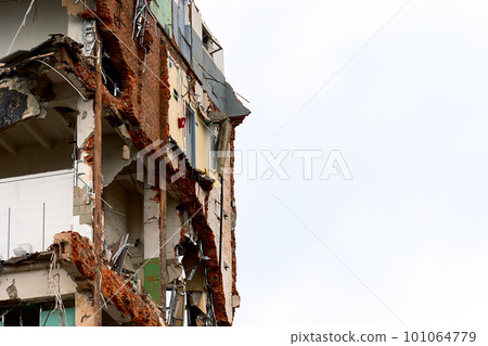 dismantled old building. Half demolished house, dismantling of the old one for the construction of a new building dismantled old building. Half demolished house, dismantling of the old one for the construction of a new building 101064779