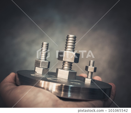 Man is holding object printed on metal 3d printer. Object printed in laser sintering machine. Modern 3D printer printing from metal powder. Progressive additive DMLS, SLM, SLS 3d printing technology Man is holding object printed on metal 3d printer. Object printed in laser sintering machine. Modern 3D printer printing from metal powder. Progressive additive DMLS, SLM, SLS 3d printing technology 101065542