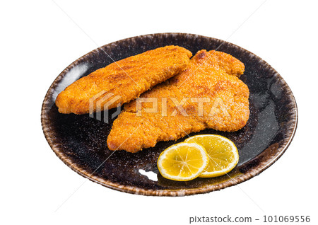 Roasted breaded german weiner schnitzel on a plate. Isolated on white background Roasted breaded german weiner schnitzel on a plate. Isolated on white background 101069556