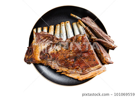 Roasted Rack of lamb ribs, mutton spareribs, sliced meat on plate. Isolated on white background. Roasted Rack of lamb ribs, mutton spareribs, sliced meat on plate. Isolated on white background. 101069559