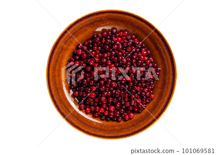Ripe Red Cranberry berry in a rustic plate. Isolated on white background Ripe Red Cranberry berry in a rustic plate. Isolated on white background 101069581