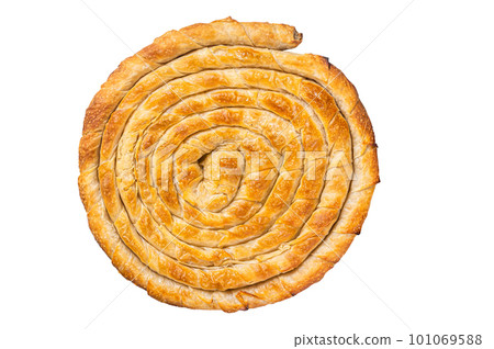 Baked homemade traditional Greek cheese pie on kitchen table. Isolated on white background Baked homemade traditional Greek cheese pie on kitchen table. Isolated on white background 101069588