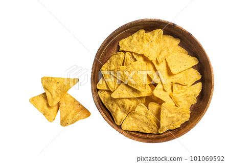 Mexican nachos corn chips in a wooden plate. Isolated on white background 101069592