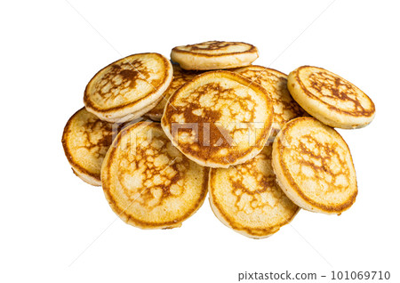 Stack of buttered pancakes on a kitchen table. Isolated on white background Stack of buttered pancakes on a kitchen table. Isolated on white background 101069710