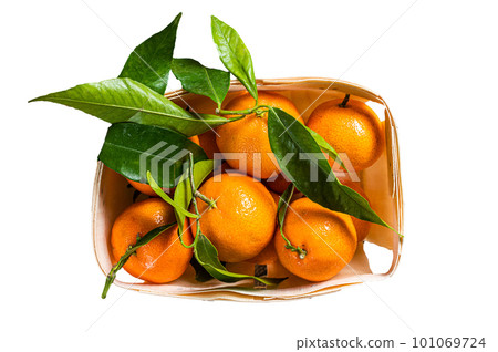 Fresh organic Tangerines, mandarins in wooden box from supermarket. Isolated on white background Fresh organic Tangerines, mandarins in wooden box from supermarket. Isolated on white background 101069724