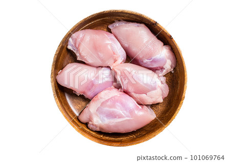 Fresh Chicken thigh meat, Raw Boneless and skinless fillet in a wooden plate. Isolated on white background Fresh Chicken thigh meat, Raw Boneless and skinless fillet in a wooden plate. Isolated on white background 101069764